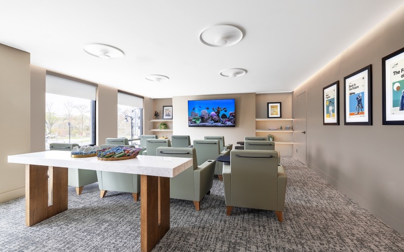 media room with lounge-style seating and a large tv