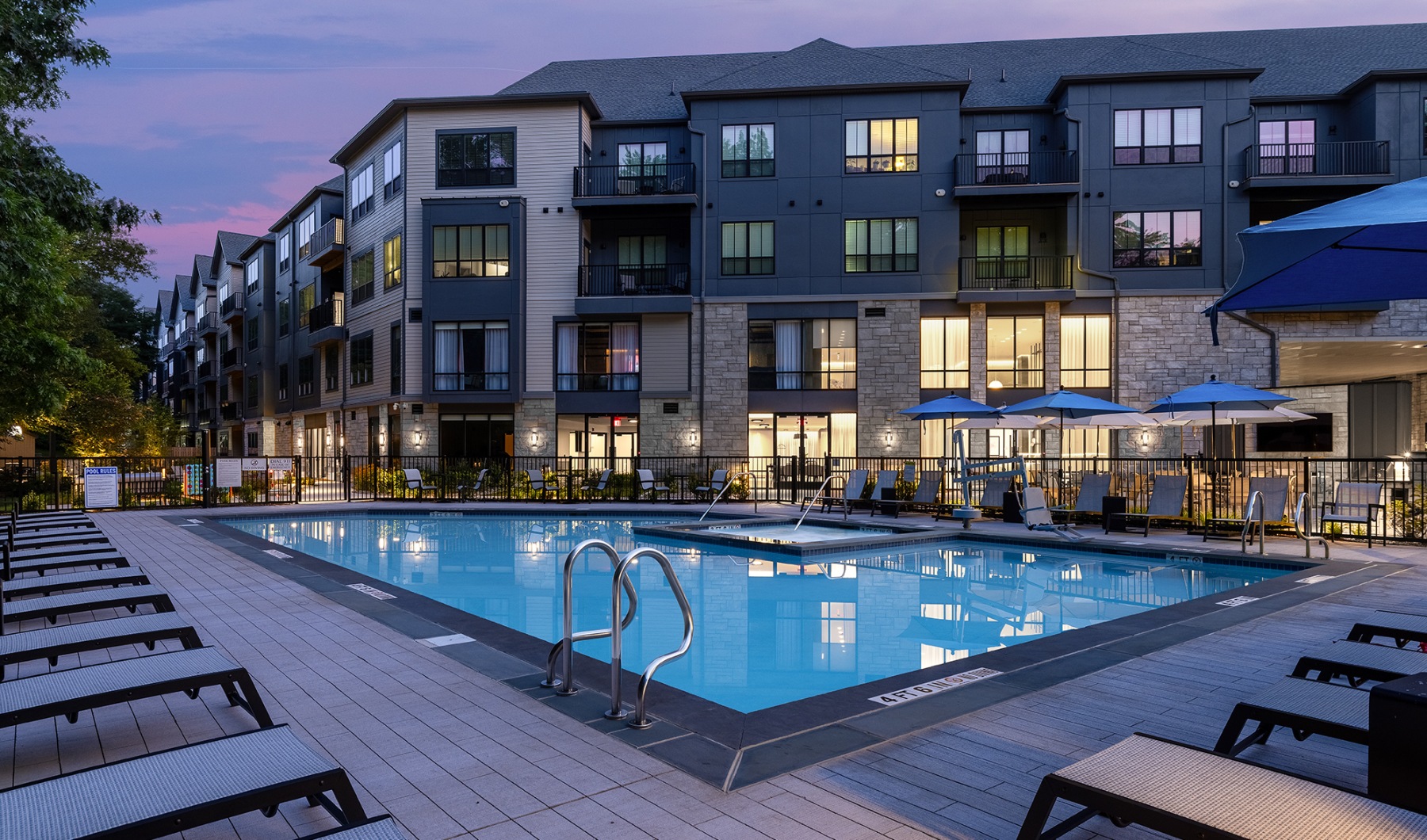 outdoor swimming pool surrounded by lounge chairs